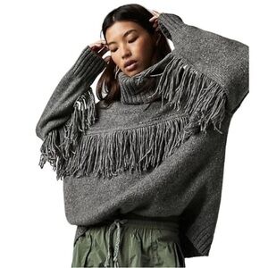 Free People glacier fringe turtleneck sweater in size XS
Oversized fit Boho